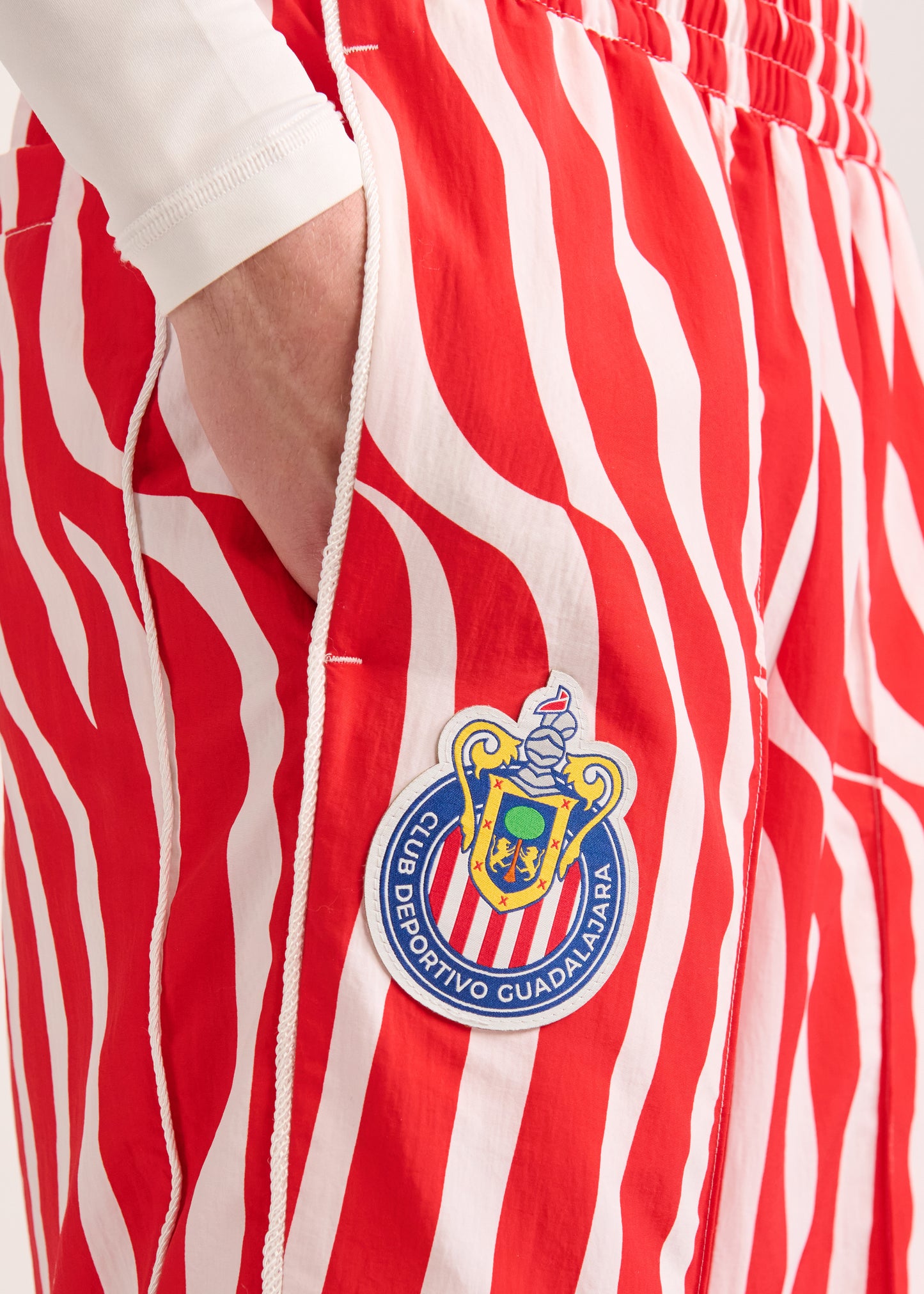 PUMA X LYM X CHIVAS RED AND WHITE SWIRL SPORT PANTS SELECT