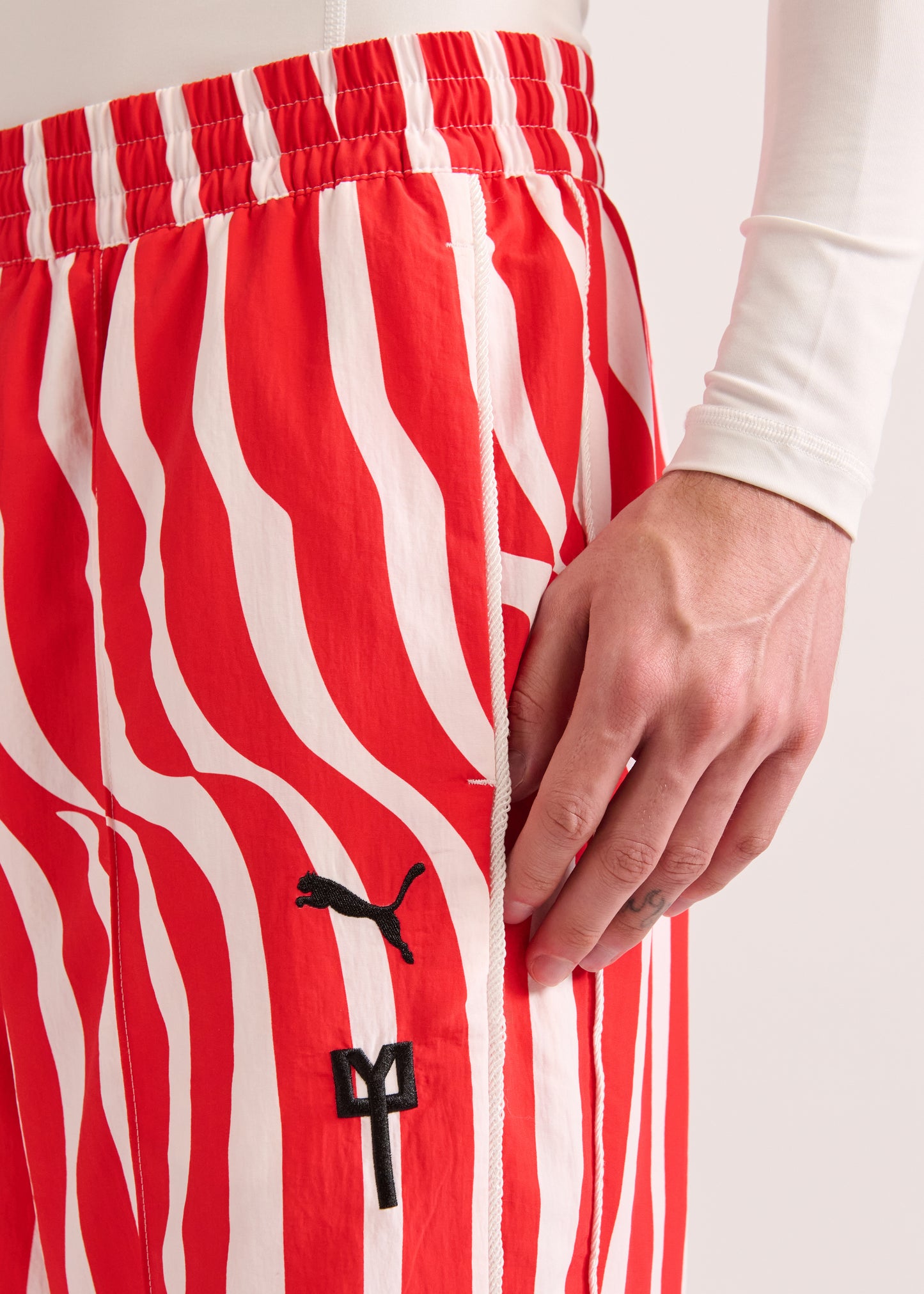 PUMA X LYM X CHIVAS RED AND WHITE SWIRL SPORT PANTS SELECT